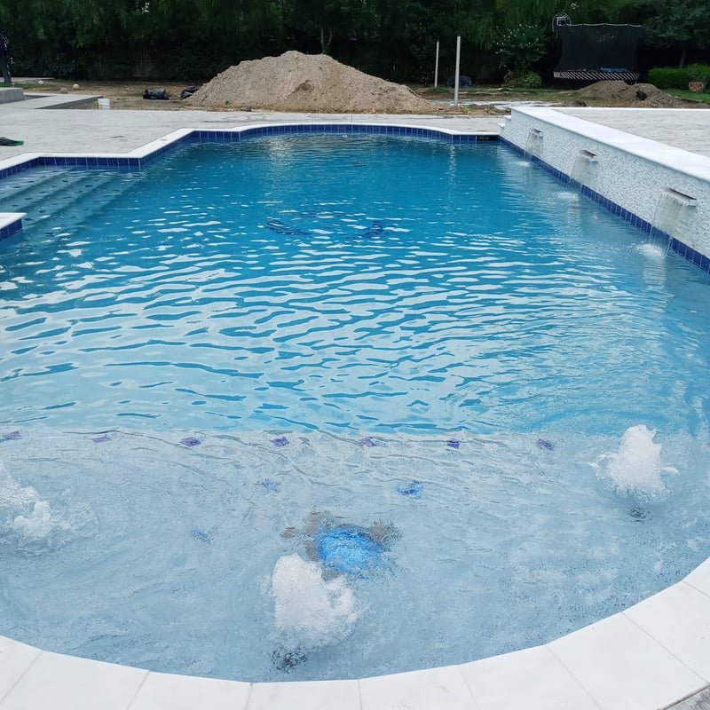 The Pool Guardian family team at a completed project