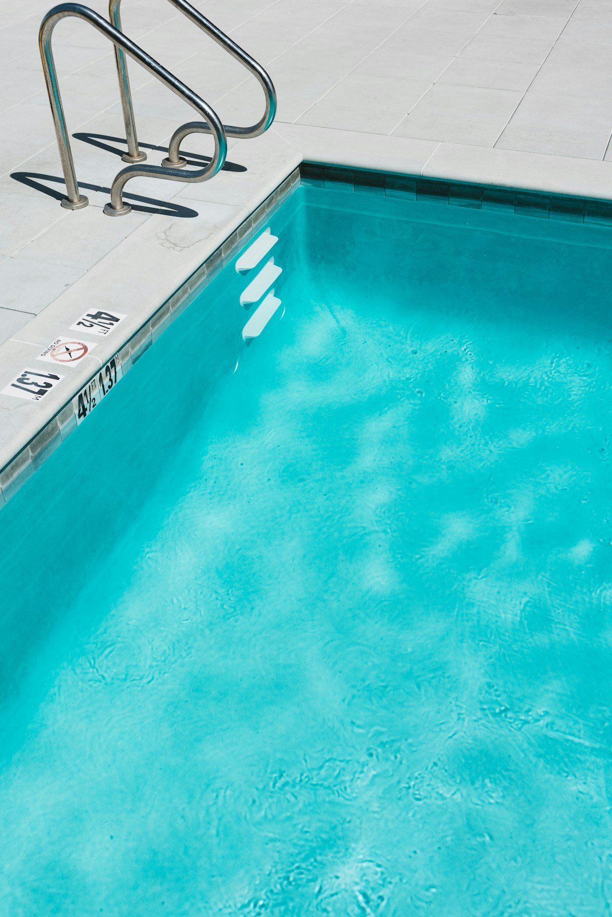 Bright blue swimming pool water after an acid wash